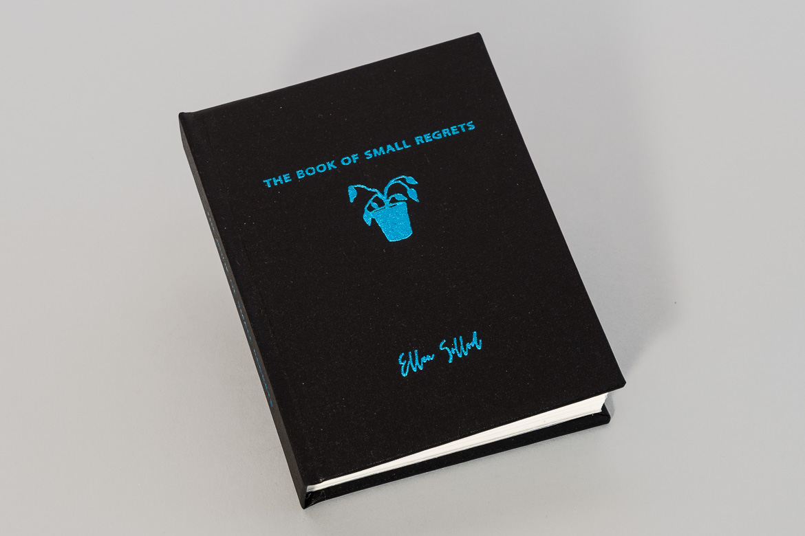 book cover, black linen with turquoise metallic foil stamp